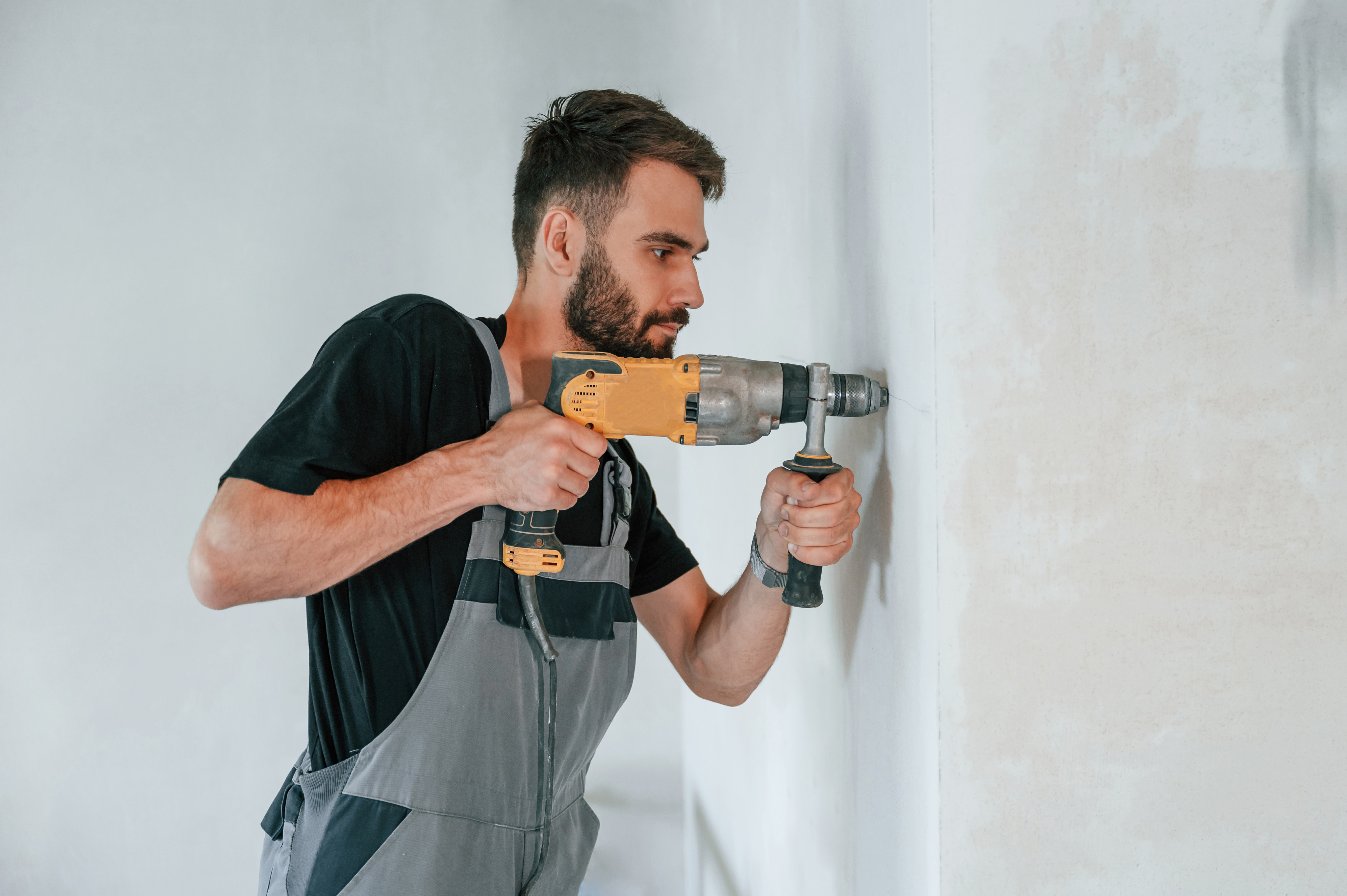 A man making repairs in an apartment