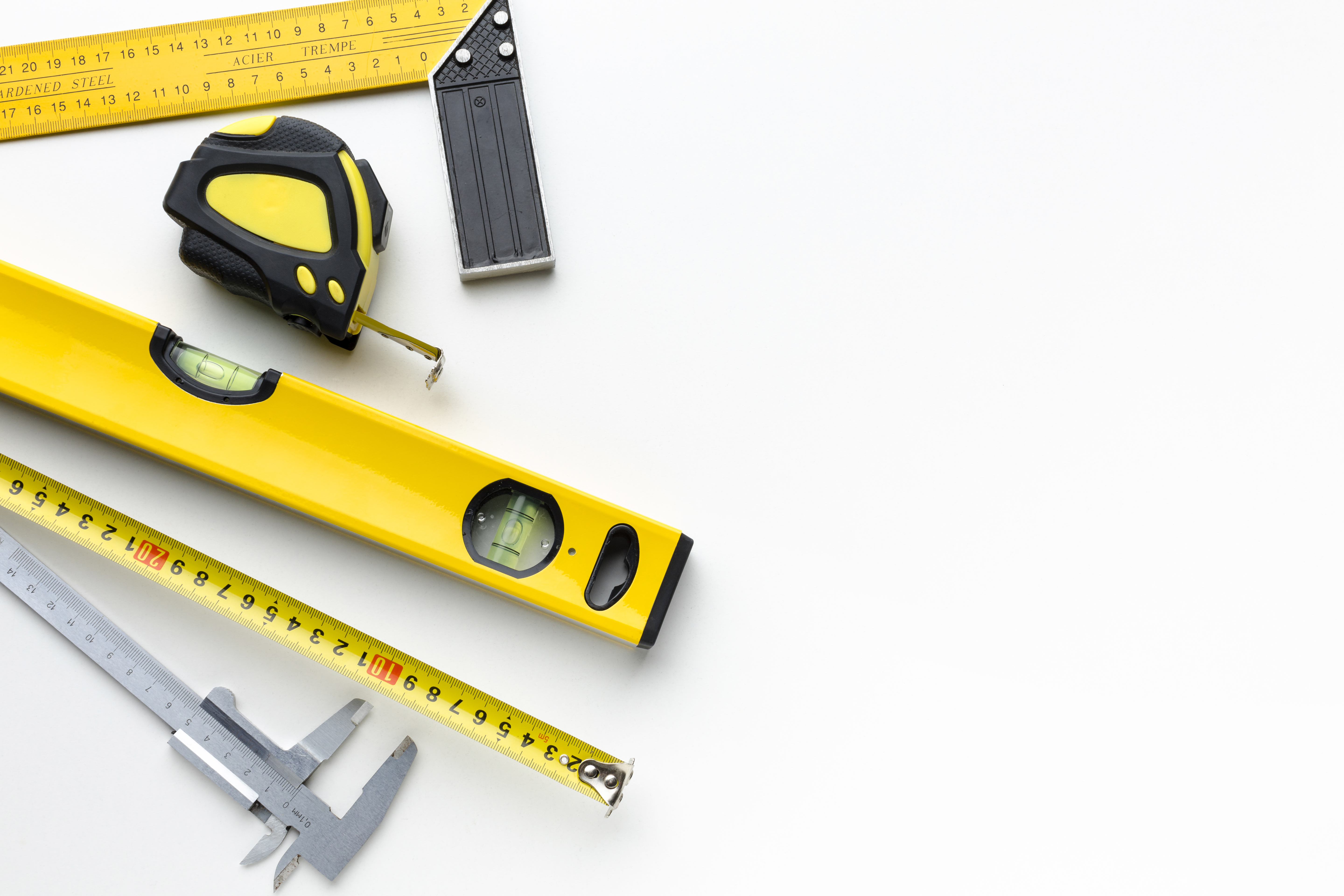 Yellow repair tools arranged on a surface with copy space